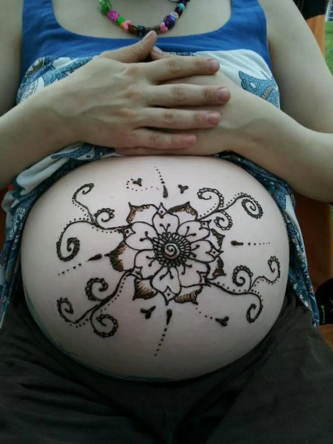 Henna on pregnant belly.